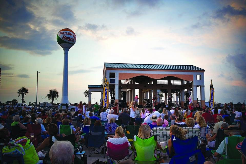 Crowds at Bands On The Beach near the Beach Ball Water Tower.