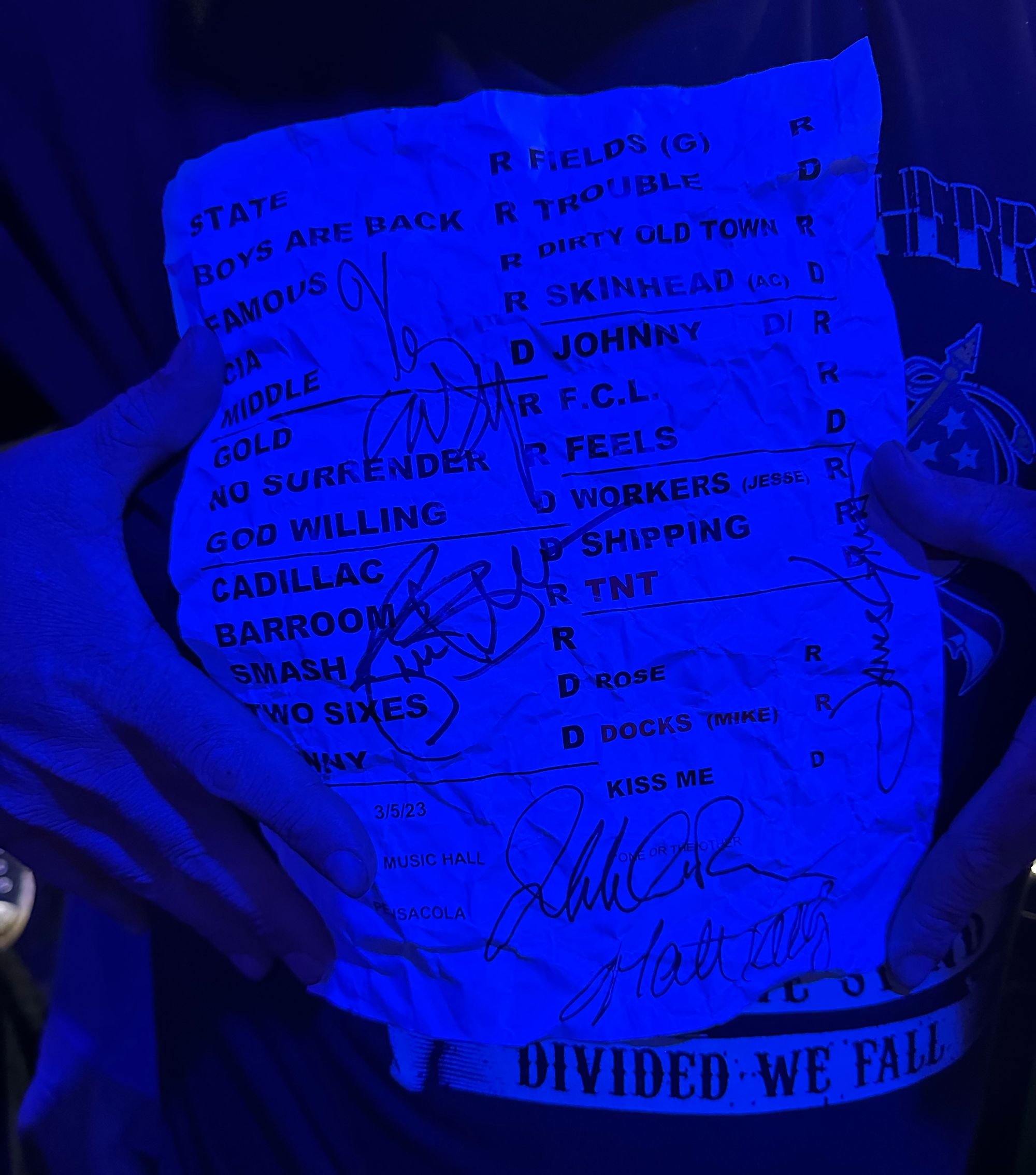 Person holding Dropkick Murphy's setlist