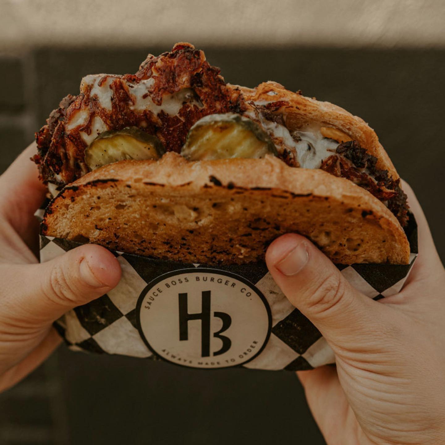 The Handlebar burger from Sauce Boss Burger Co. Photo by @theturningpagephotoco