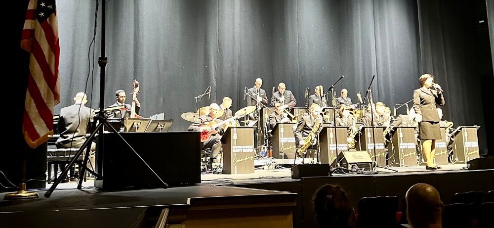 The U.S. Navy Band Commodores performing onstage at the Saenger Theatre in Pensacola