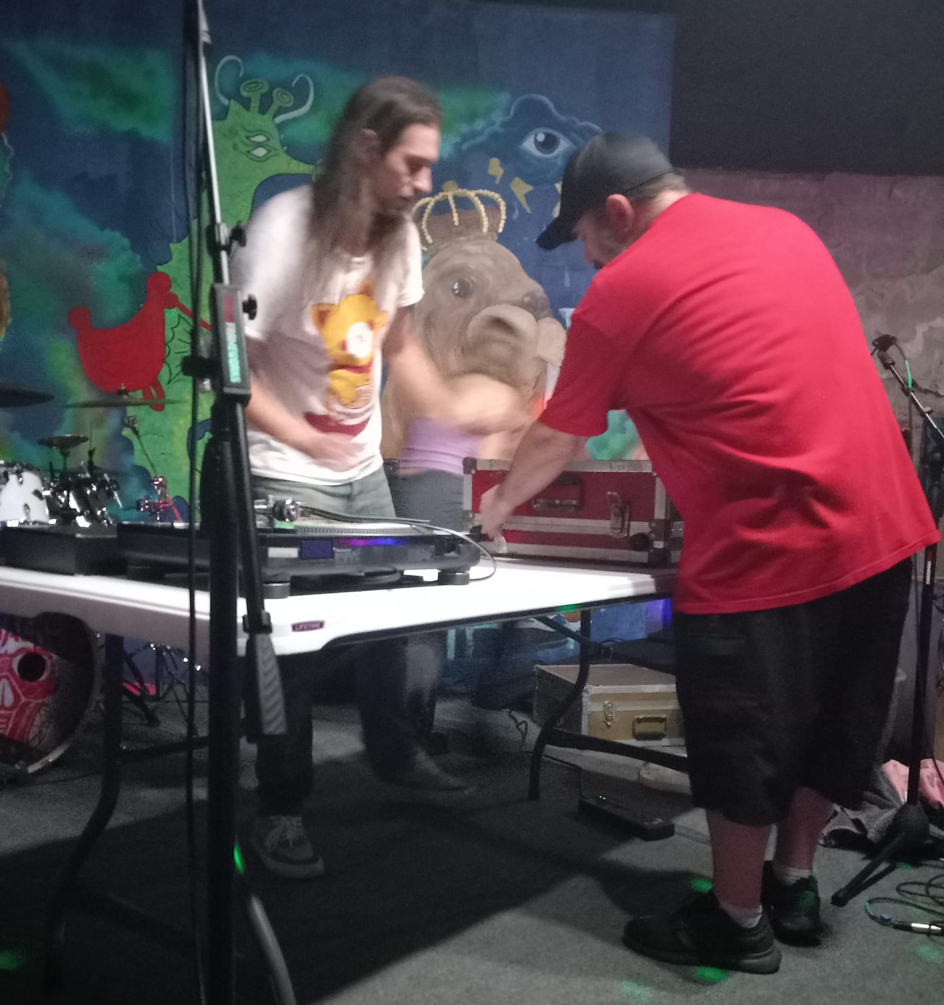 Owner Chris helps a DJ pack his gear