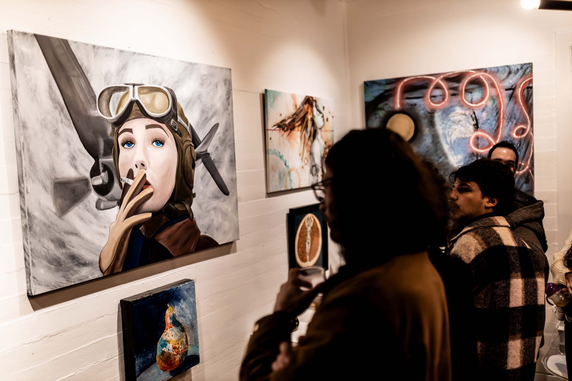 Patrons enjoying the Herstory exhibit