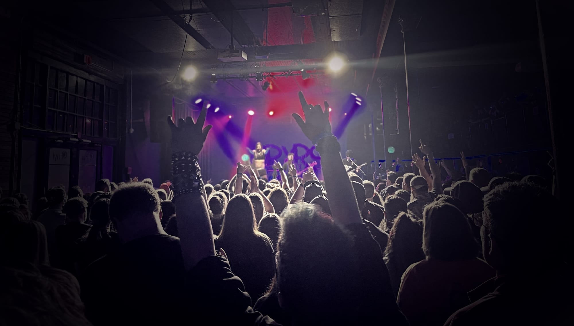 Shot from the back of the crowd with Cryrs on stage.